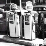 1953 Oldsmobile at gas station